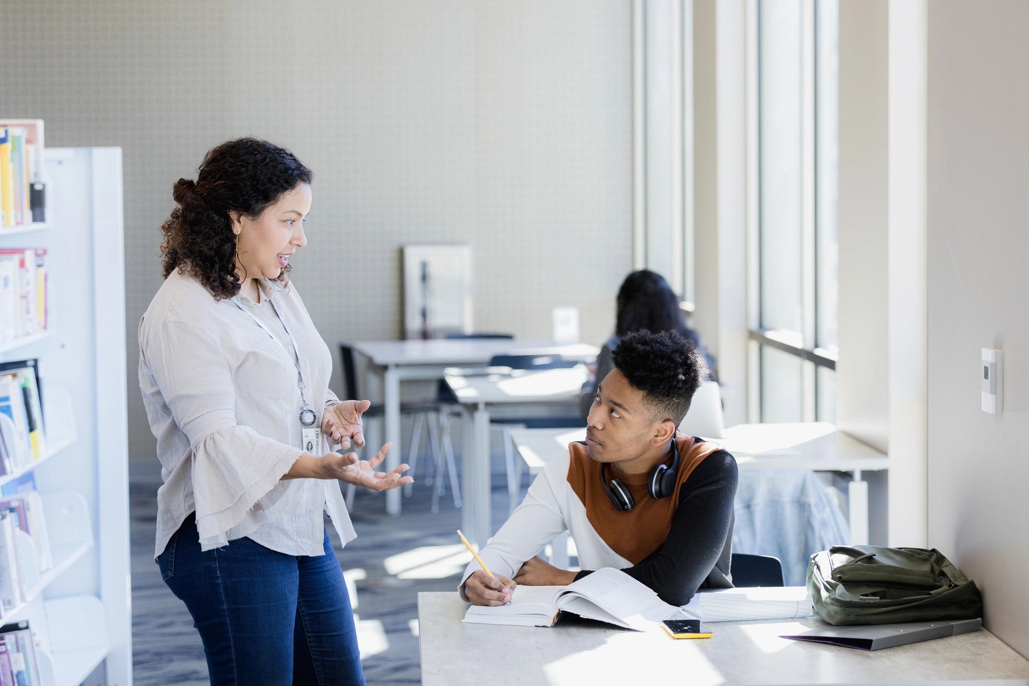 Student receiving guidance from an educator
