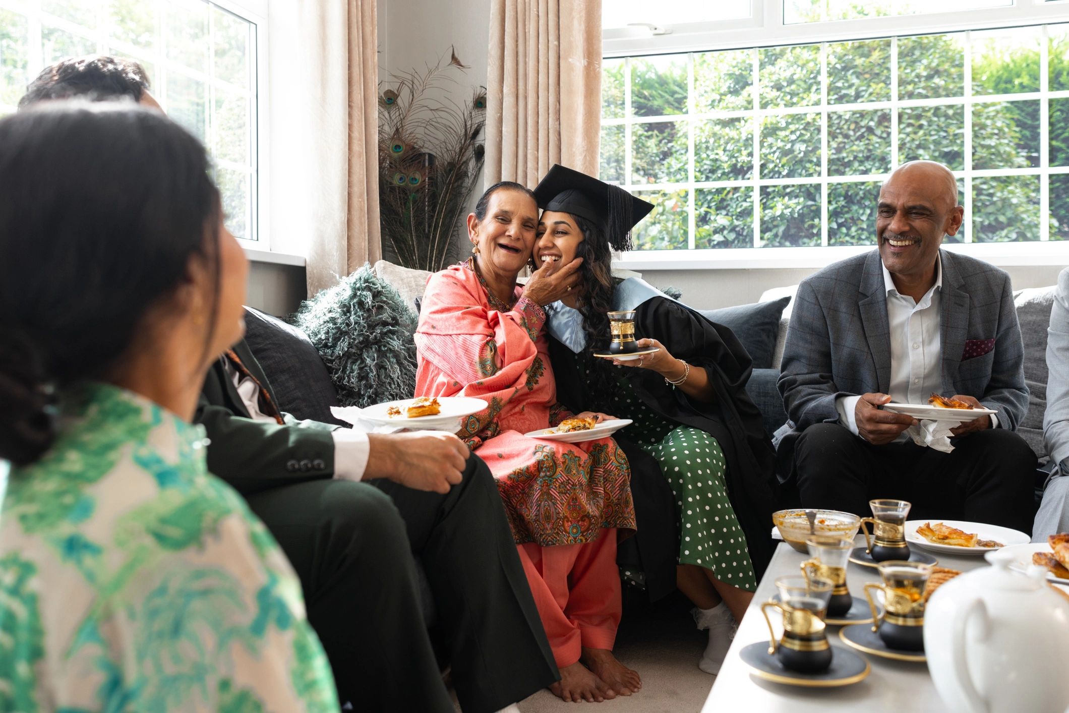Student celebrating graduation with family support