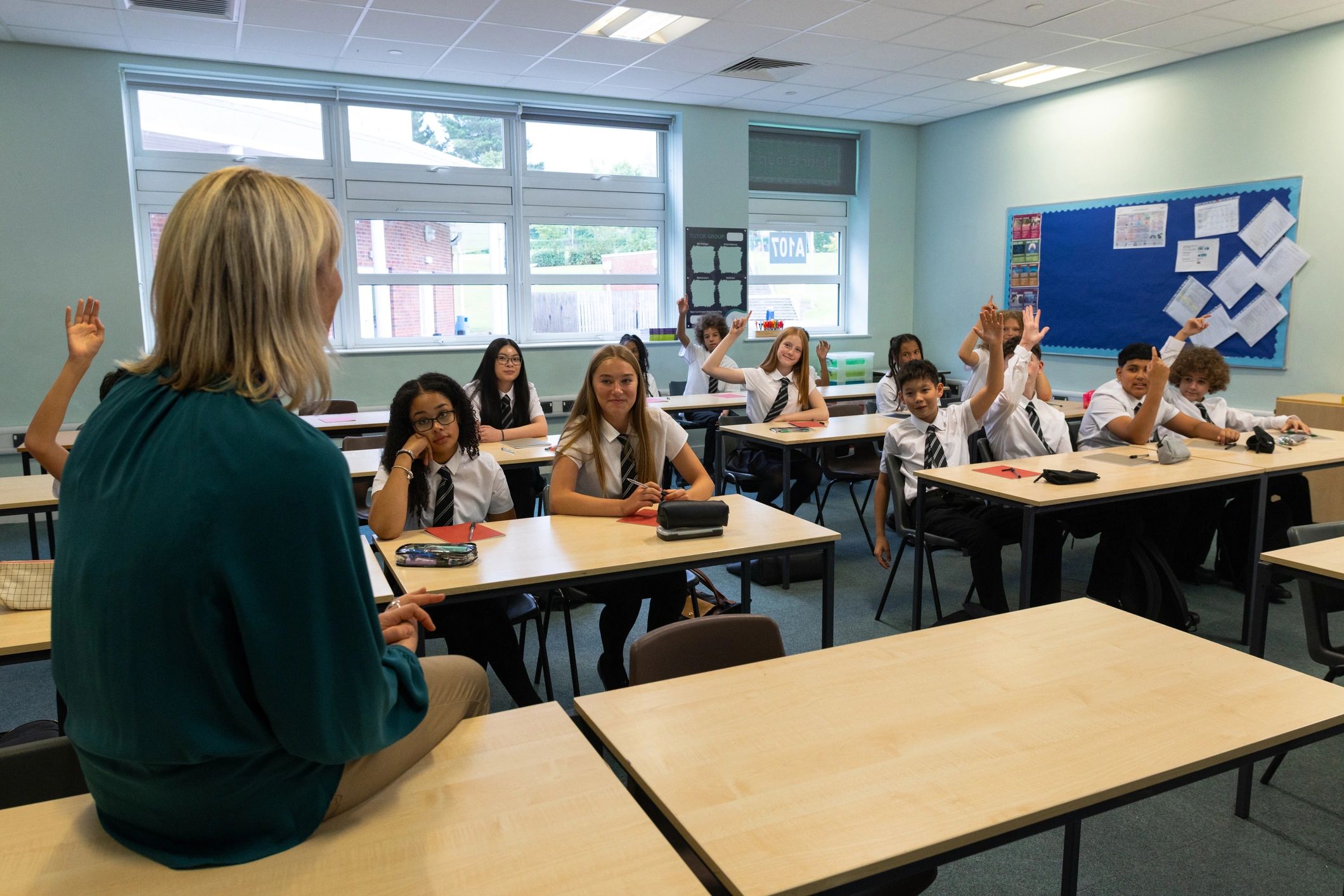 Teacher leading a classroom of engaged students